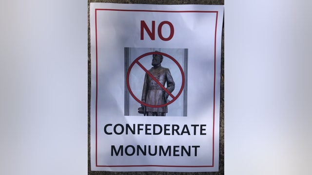 Protest over confederate statue leads to woman being removed from meeting
