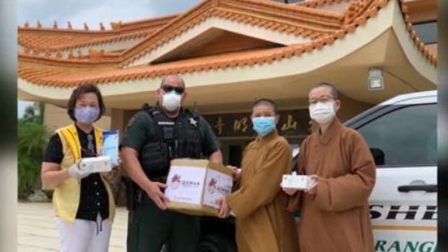 Buddhist monks deliver masks to first responders