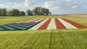 Indiana man paints giant American flag on lawn in honor of health care workers