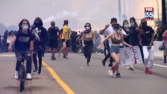 Orlando police officers clear protesters off State Road 408, reopen lanes