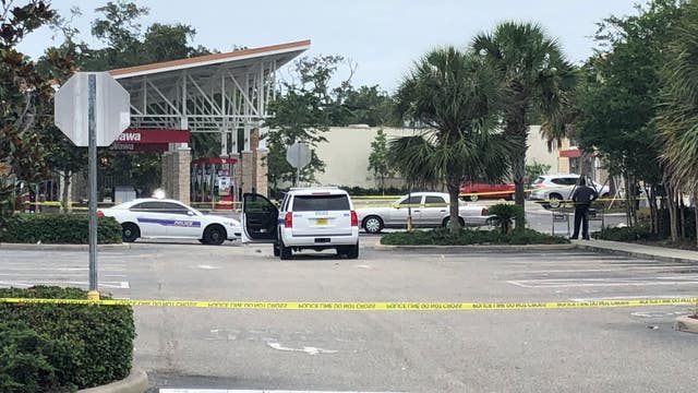 Man armed with rifle shot by Florida officers after attempted carjacking, police say