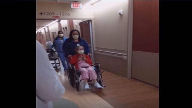 Nurses line up to cheer on 71-year-old woman who survived COVID-19