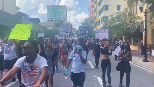 Rowdy crowds met with pepper spray during march to protest deadly arrest of George Floyd