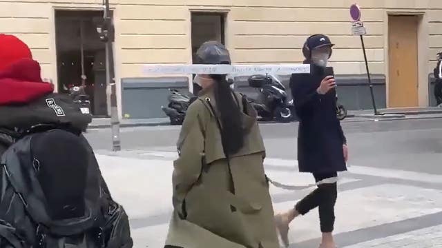 Video shows Paris resident wearing creative 3-foot-long social distancing device in public
