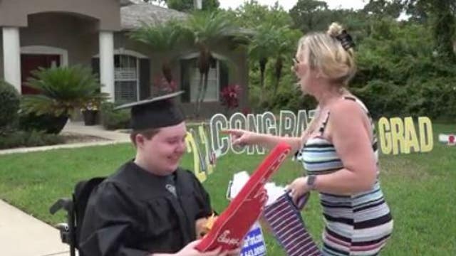 High school senior with compromised immune system surprised by drive-by graduation parade