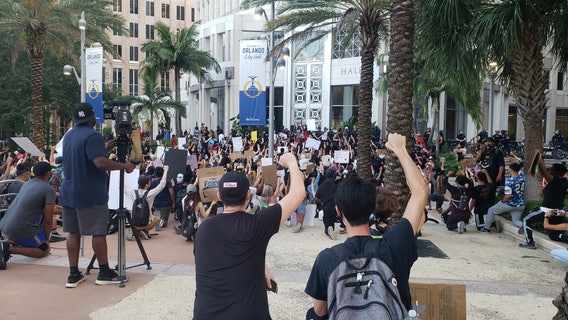 Protesters converge peacefully on the steps of Orlando City Hall