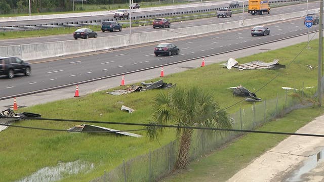 High winds blow roofs from flea market onto I-95 in Daytona Beach