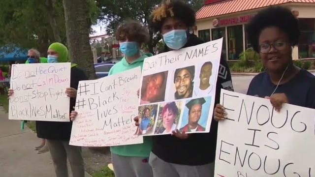 Demonstrators rally for justice in New Smyrna Beach, register people to vote