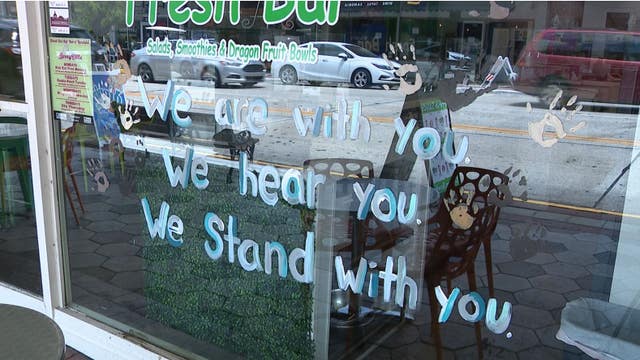 Police officers, business owners join protesters at DeLand rally