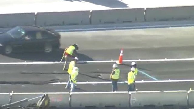 Cracked asphalt on new portion of I-4 replaced on Thursday morning, causing traffic delays