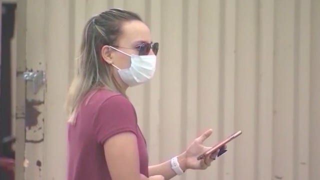 Orange County residents could be wearing masks until a vaccine is developed, official warns