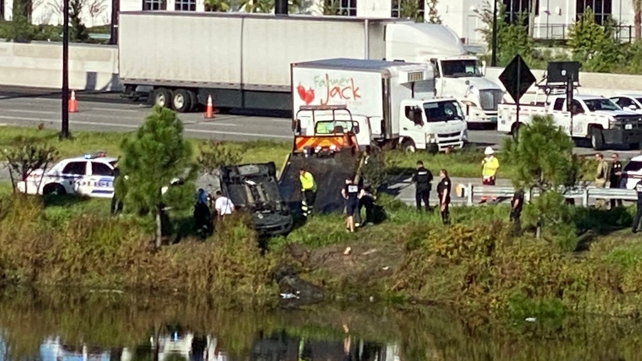 Woman pulled from car that crashed into retention pond near Mall