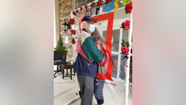 Hugging station reunites loved ones at Alpharetta assisted living facility