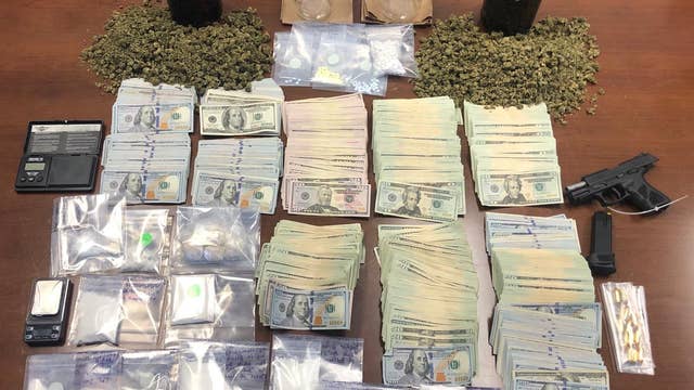 Deputies: Drugs, gun, over $100K in cash found inside Lake County home