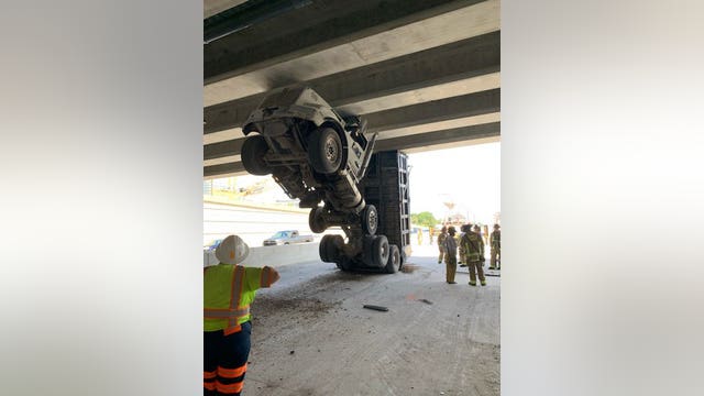 Trucker rescued after vehicle gets stuck under Central Florida overpass