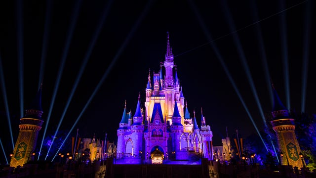 Cinderella's Castle at Magic Kingdom lights up in purple and gold after Los Angeles Lakers win NBA Finals