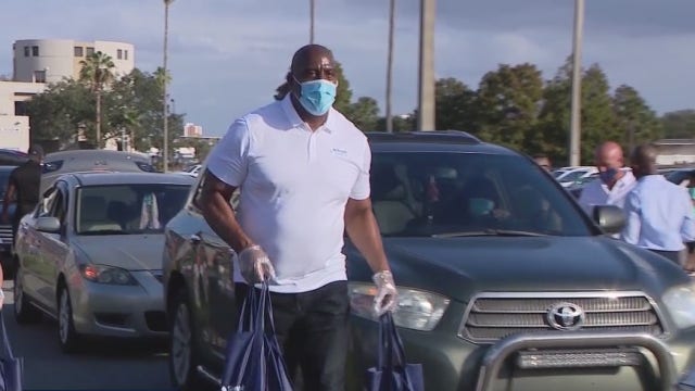NBA legend Magic Johnson provides Thanksgiving meals for Orlando families