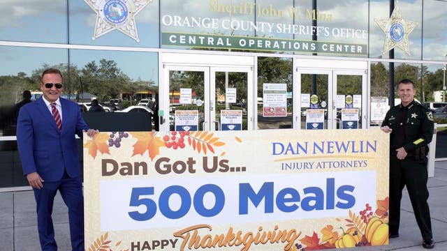 Attorney Dan Newlin helps provide Thanksgiving meals to local families
