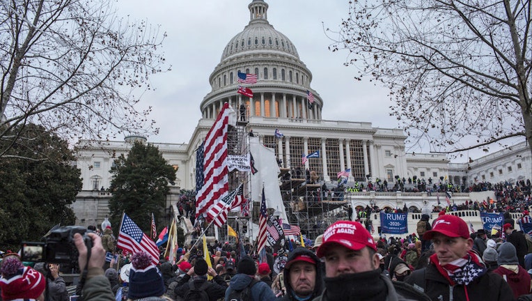 FILE - US President Donald Trump's supporters gather outside the Capitol building.