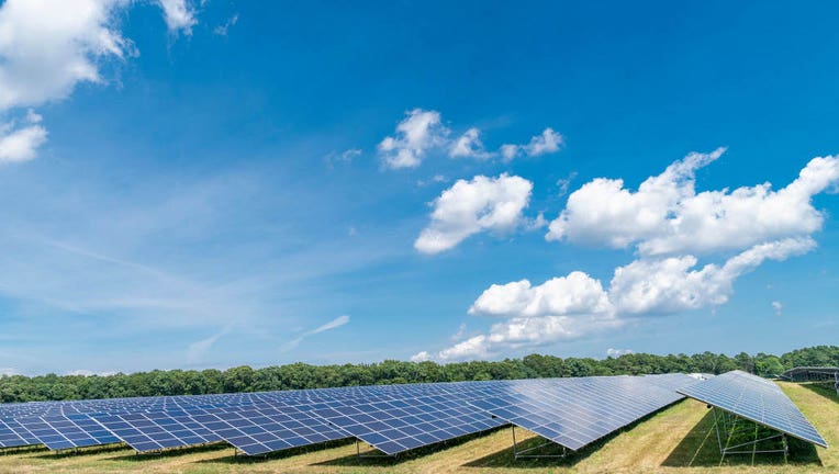 A file image shows a solar power plant farm in New York. The Biden administration is directing federal agencies to eliminate fossil fuel subsidies and 