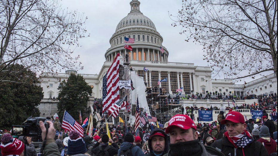 FILE - US President Donald Trump's supporters gather outside the Capitol building.