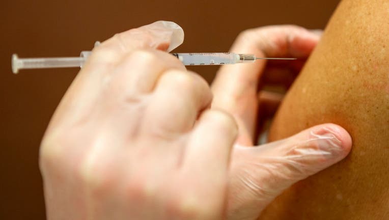 FILE - A COVID-19 vaccine is administered into a person’s arm. (Photo by: Jose More/VWPics/Universal Images Group via Getty Images)