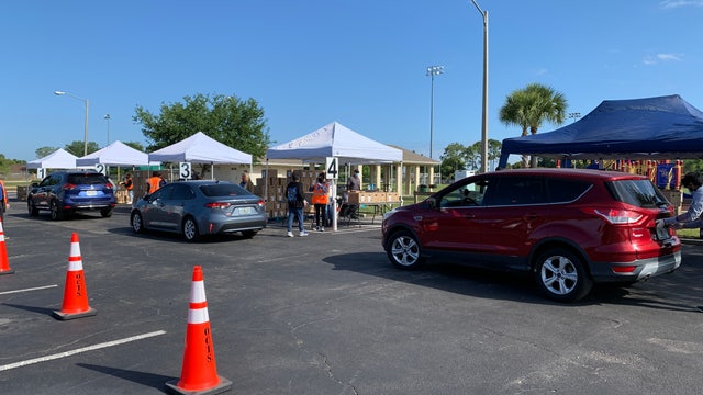 Families in need line up for Farm Share food giveaway in Kissimmee