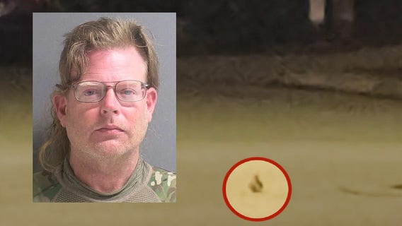 Man accused of placing grenade in roadway, then calling 911 to report