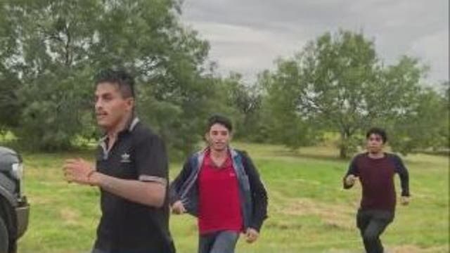 Video shows migrants running past border patrol agents in Texas