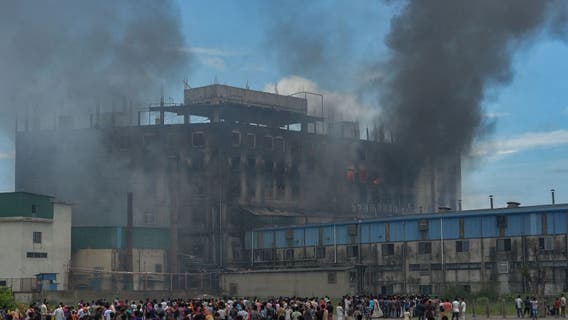 Bangladesh factory fire: 52 dead after workers trapped by illegally locked door