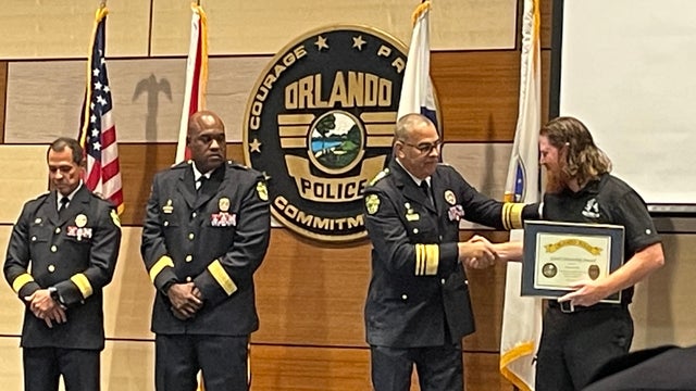 Veteran gets award from Orlando Police for saving co-worker's life