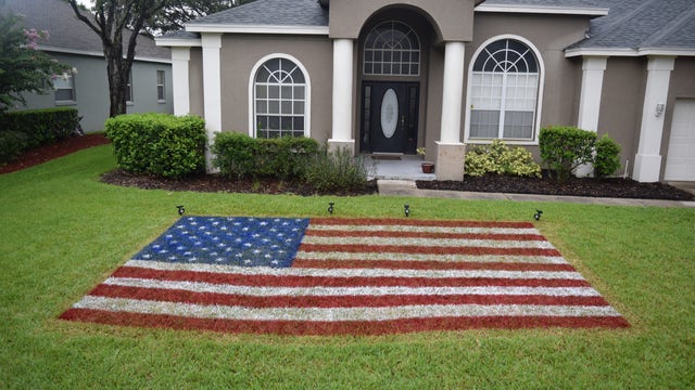 Central Florida resident celebrates 4th of July with patriotic lawn painting