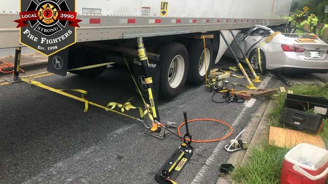 1 injured after car ended up underneath semi in Lake County