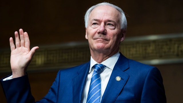 Arkansas governor says he regrets signing mask ban amid COVID-19 surge