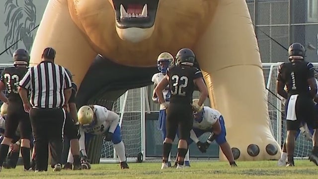 Florida high school football players train in brutal heat