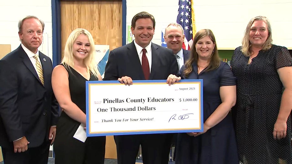 desantis-gives-teacher-checks-2.jpg