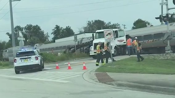 Driver leaps from truck before Amtrak train strikes, police say