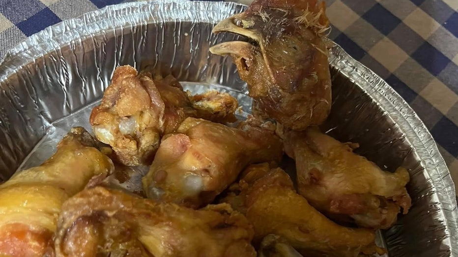 Woman claims she found fried chicken head in take-out order