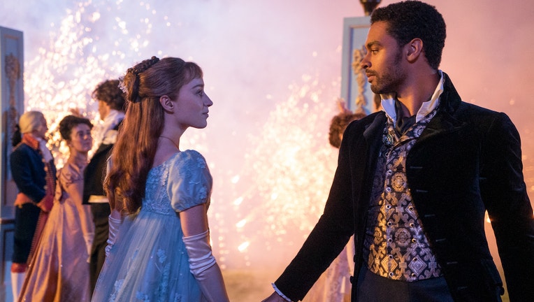 BRIDGERTON (L to R) PHOEBE DYNEVOR as DAPHNE BRIDGERTON and REGÉ-JEAN PAGE as SIMON BASSET in episode 101 of BRIDGERTON Cr. LIAM DANIEL/NETFLIX © 2020