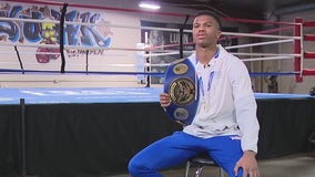 Young boxer making history, lifting people up along the way