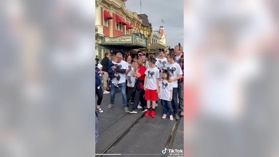Grandmother surprised at Disney's Magic Kingdom by family for her 70th birthday