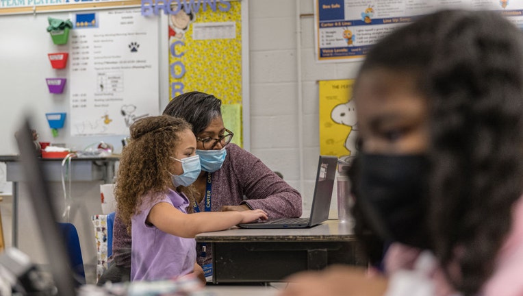 Students work on laptops