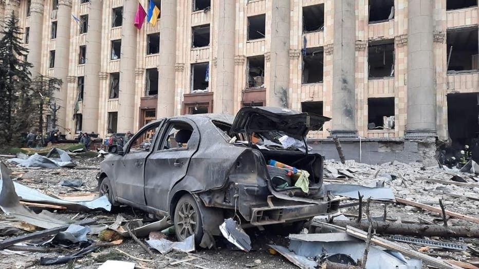KHARKIV, UKRAINE - MARCH 01: A view of damaged Kharkiv governor's office and a wrecked vehicle is seen after the Russian army's missile attack in Kharkiv, Ukraine on March 1, 2022. (Photo by State Emergency Service of Ukraine/Anadolu Agency via Getty Images)