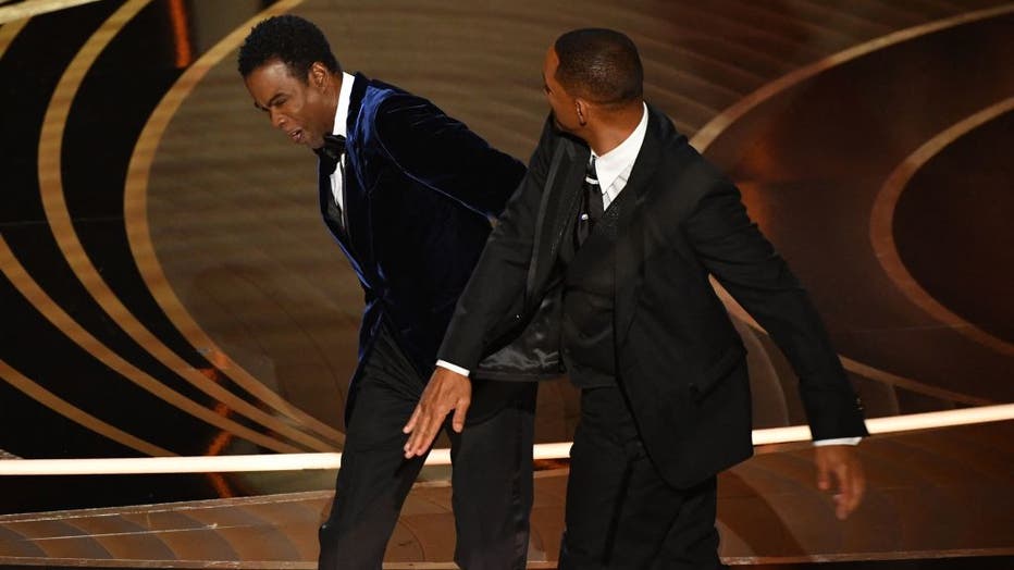 US actor Will Smith (R) slaps US actor Chris Rock onstage during the 94th Oscars at the Dolby Theatre in Hollywood, California on March 27, 2022. (Photo by ROBYN BECK/AFP via Getty Images)