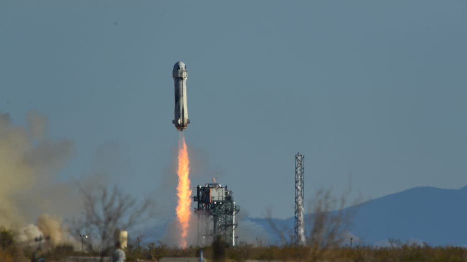 A Blue Origin New Shepard rocket launches from Launch Site One in West Texas north of Van Horn on March 31, 2022. - The NS-20 mission carries Blue Origins New Shepard Chief Architect Gary Lai, Marty Allen, Sharon Hagle, Marc Hagle, Jim Kitchen, and Dr. George Nield into space. (Photo by PATRICK T. FALLON/AFP via Getty Images)