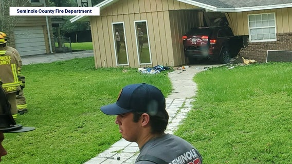 SUV crashes into front entrance of Longwood home, firefighters say