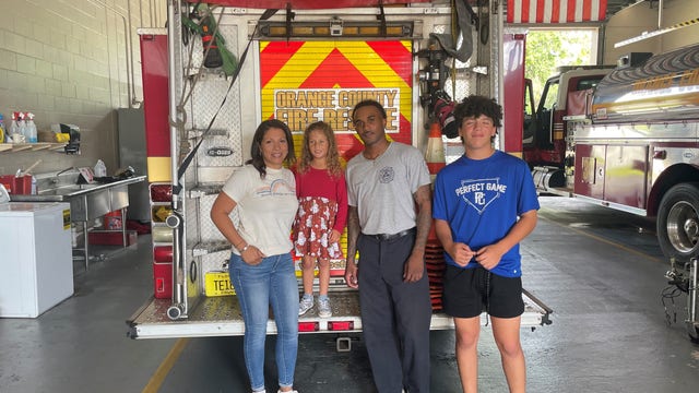 Orange County firefighter honored for helping family trapped in car while off duty