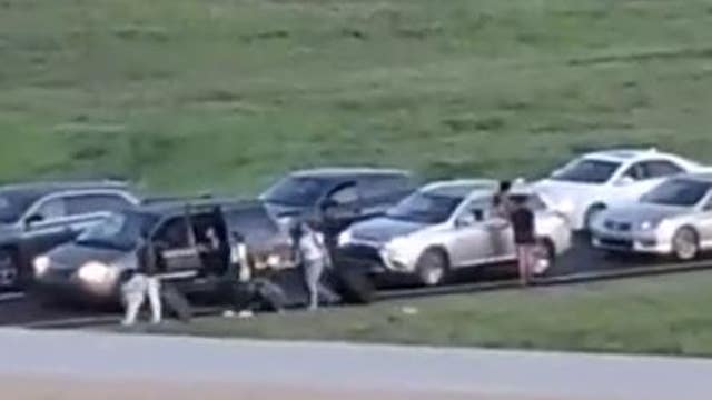Travelers walk to Orlando airport after deadly crash causes major delays