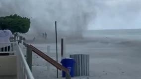 Video shows Florida beachgoers getting caught in waterspout as it moves onshore