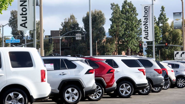 FILE - Vehicles are displayed for sale at a car dealership on April 21, 2022, in Valencia, California. (Photo by Mario Tama/Getty Images)